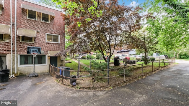 100 Lakeview Dr, Ridley Park, PA 19078 - view of property exterior featuring brick siding and fence