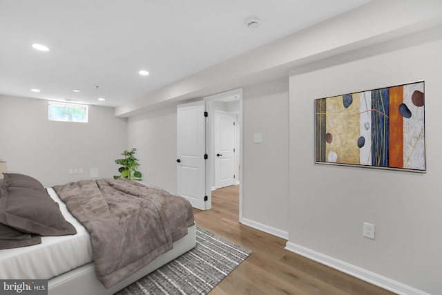 bedroom featuring recessed lighting, baseboards, and wood finished floors
