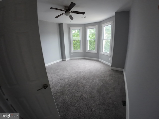 1632 Moreland Ave, Baltimore, MD 21216 - spare room featuring carpet, baseboards, and ceiling fan
