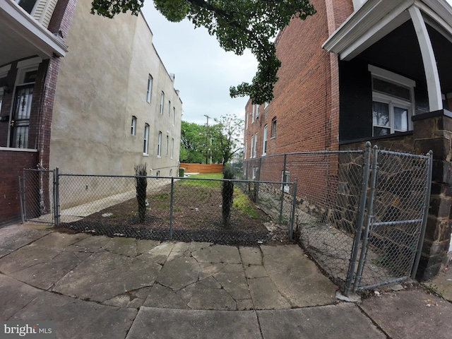 1632 Moreland Ave, Baltimore, MD 21216 - view of home's exterior with a gate and fence