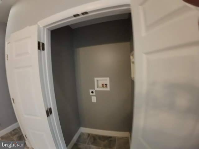 1632 Moreland Ave, Baltimore, MD 21216 - laundry area featuring hookup for a washing machine, electric dryer hookup, dark tile patterned flooring, and baseboards