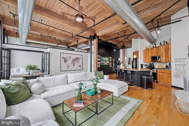 living room with light wood finished floors, wooden ceiling, and a ceiling fan