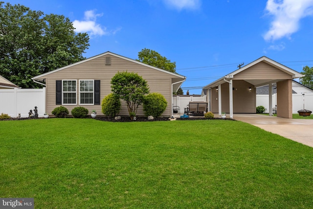 37 Graceful Ln, Levittown, PA 19055 - view of front of house with fence, a front lawn, an attached carport, and driveway