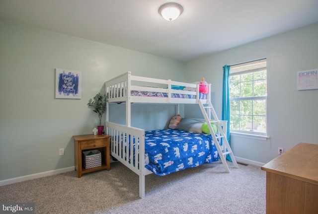 bedroom with baseboards and carpet flooring