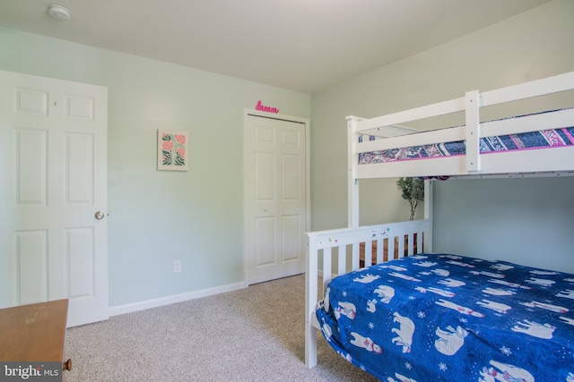 carpeted bedroom with baseboards