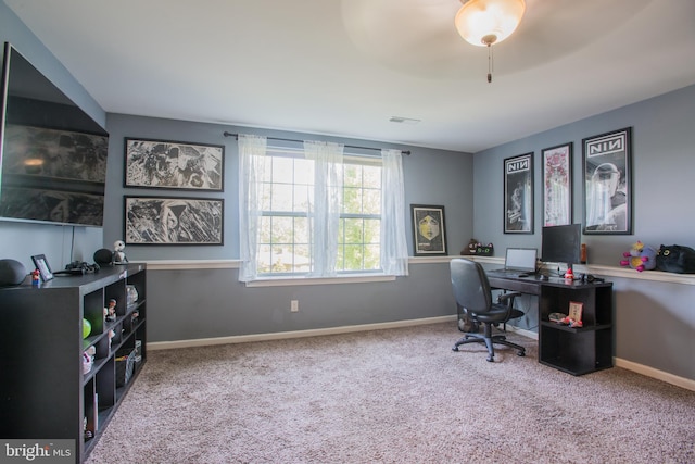 carpeted office with baseboards and visible vents