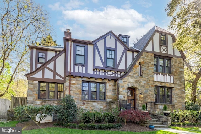 2840 Chesapeake St NW, Washington, DC 20008 - exterior space featuring fence, stucco siding, a chimney, and stone siding