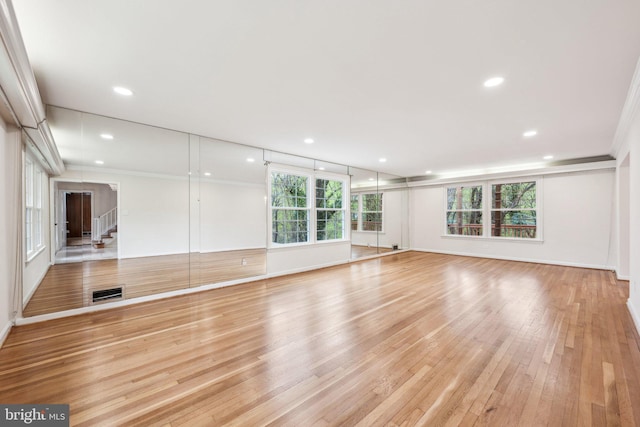 interior space with light wood-style floors, baseboards, recessed lighting, and visible vents