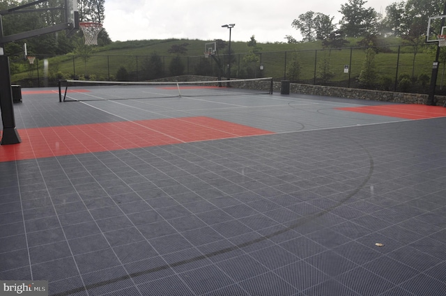 view of sport court with community basketball court and fence