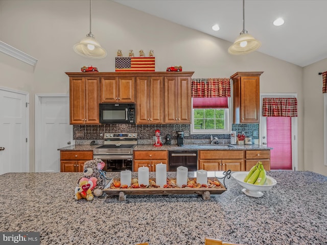 kitchen featuring black appliances, a sink, decorative backsplash, pendant lighting, and high vaulted ceiling