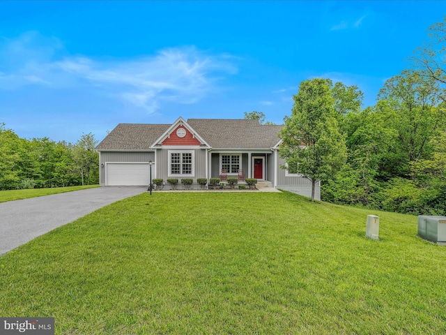 ranch-style home with concrete driveway, a front yard, an attached garage, board and batten siding, and a shingled roof