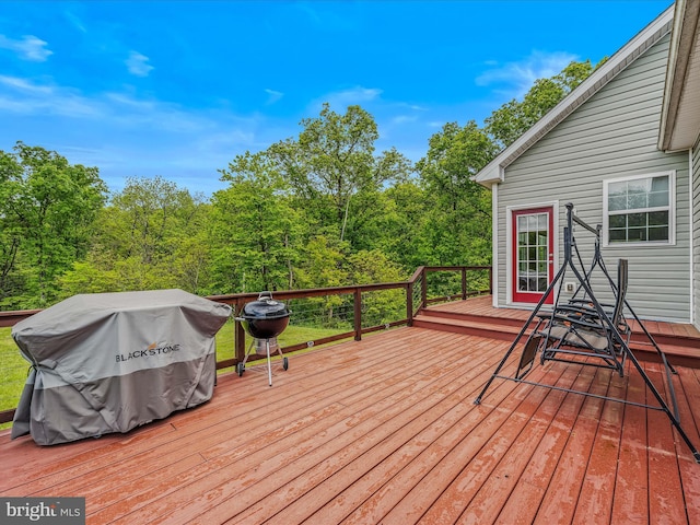 deck featuring a grill