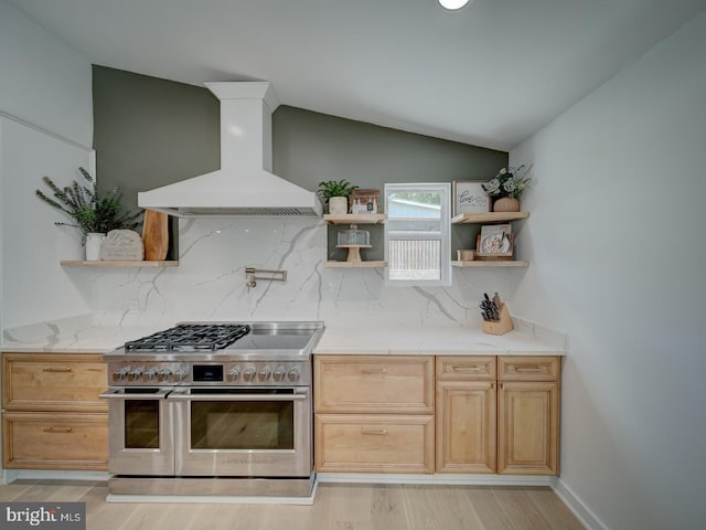 1782 Shaftsbury Ave, Crofton, MD 21114 - kitchen featuring open shelves, range with two ovens, wall chimney exhaust hood, tasteful backsplash, and light wood-style floors