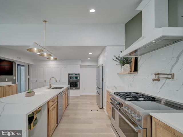1782 Shaftsbury Ave, Crofton, MD 21114 - kitchen with wall chimney exhaust hood, stainless steel appliances, a sink, light wood-type flooring, and open shelves