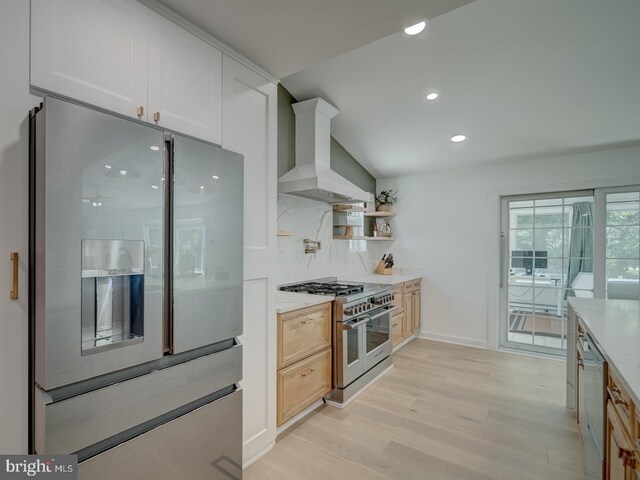 1782 Shaftsbury Ave, Crofton, MD 21114 - kitchen featuring stainless steel appliances, ventilation hood, light wood-type flooring, tasteful backsplash, and recessed lighting