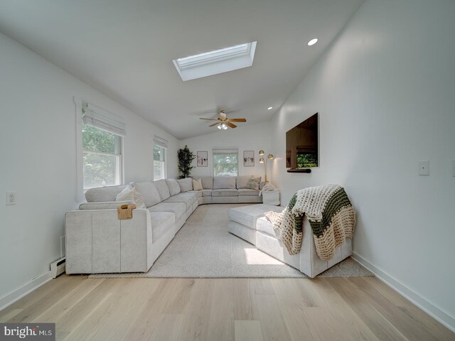 1782 Shaftsbury Ave, Crofton, MD 21114 - living room featuring wood finished floors, healthy amount of natural light, a skylight, lofted ceiling, and recessed lighting