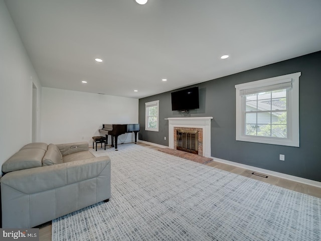 1782 Shaftsbury Ave, Crofton, MD 21114 - living area featuring a fireplace, recessed lighting, wood finished floors, and baseboards