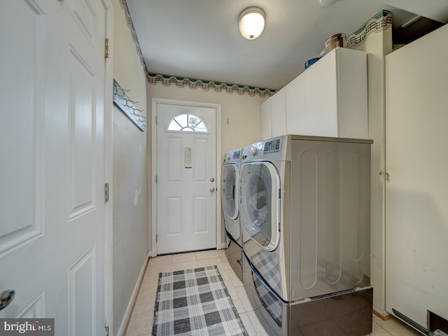 1782 Shaftsbury Ave, Crofton, MD 21114 - washroom with cabinet space, washer and dryer, light tile patterned flooring, and baseboards