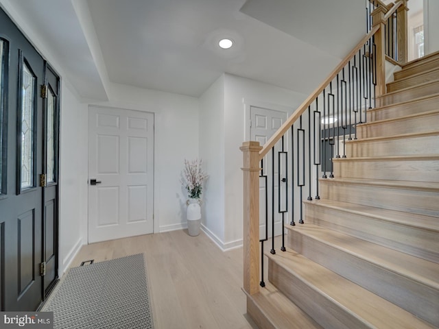 1782 Shaftsbury Ave, Crofton, MD 21114 - entryway with wood finished floors, stairs, baseboards, and recessed lighting