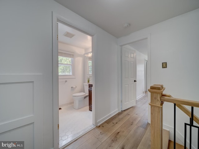 1782 Shaftsbury Ave, Crofton, MD 21114 - corridor with an upstairs landing, light wood-type flooring, and baseboards