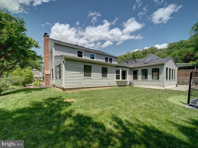 1782 Shaftsbury Ave, Crofton, MD 21114 - rear view of house featuring a yard and a chimney