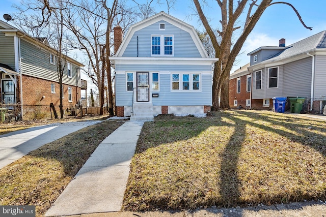 2903 Woodland Ave, Baltimore, MD 21215 - colonial inspired home featuring a chimney, a gambrel roof, a front yard, and entry steps