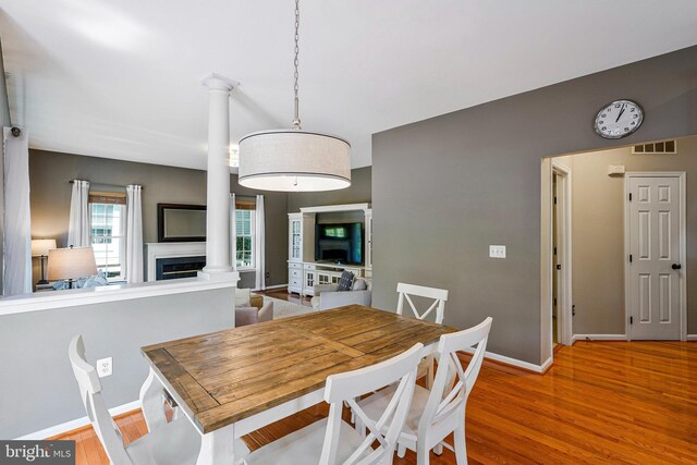 21591 Awbrey Pl, Broadlands, VA 20148 - dining space featuring ornate columns, baseboards, and wood finished floors