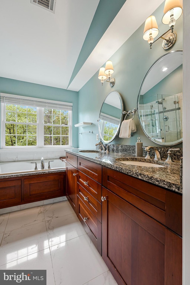 21591 Awbrey Pl, Broadlands, VA 20148 - full bathroom with marble look tiles, a shower stall, double vanity, a garden tub, and lofted ceiling
