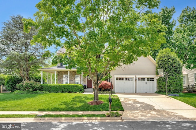 21591 Awbrey Pl, Broadlands, VA 20148 - view of property hidden behind natural elements with a front lawn, a garage, concrete driveway, and stone siding