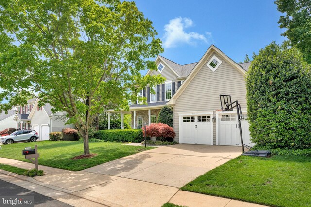 21591 Awbrey Pl, Broadlands, VA 20148 - traditional-style home featuring concrete driveway and a front lawn