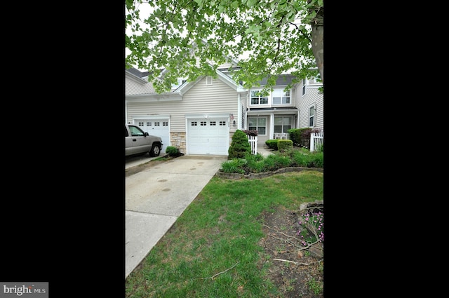 208 Starboard Way, Mount Laurel, NJ 08054 - view of front facade featuring an attached garage, concrete driveway, and stone siding