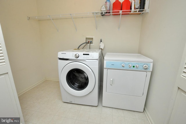 208 Starboard Way, Mount Laurel, NJ 08054 - laundry area featuring independent washer and dryer, light tile patterned flooring, and baseboards