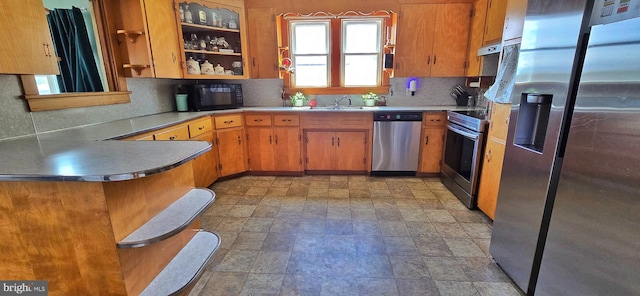 8074 Molly Pitcher Hwy, Shippensburg, PA 17257 - kitchen with stainless steel appliances, tasteful backsplash, brown cabinetry, and light countertops