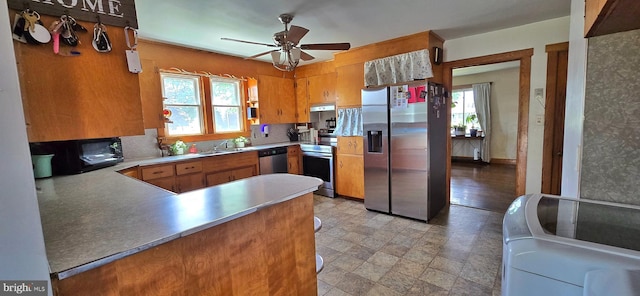 8074 Molly Pitcher Hwy, Shippensburg, PA 17257 - kitchen with appliances with stainless steel finishes, plenty of natural light, a ceiling fan, and brown cabinets