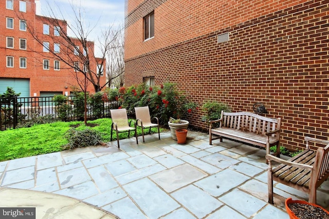 view of patio / terrace featuring fence