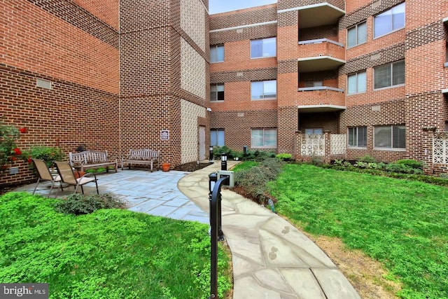 view of property's community with a patio