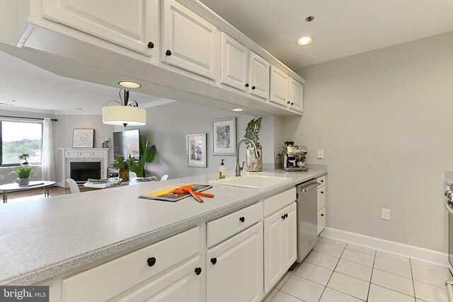 1050 N Stuart St Unit 617, Arlington, VA 22201 - kitchen featuring a sink, dishwasher, a fireplace, light tile patterned floors, and light countertops