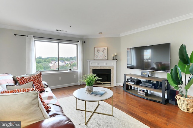 1050 N Stuart St Unit 617, Arlington, VA 22201 - living area with crown molding, wood finished floors, a fireplace, and baseboards