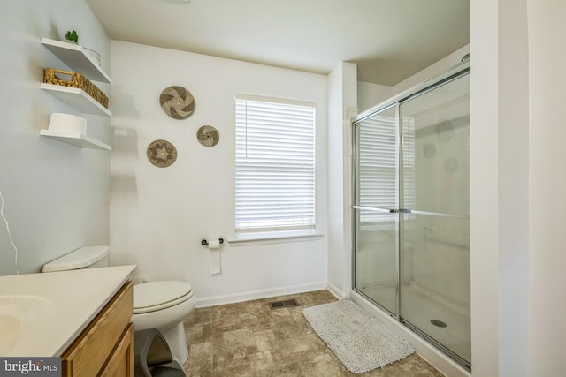 31 Walters Way, Dover, DE 19904 - bathroom with a tile shower, vanity, toilet, and baseboards