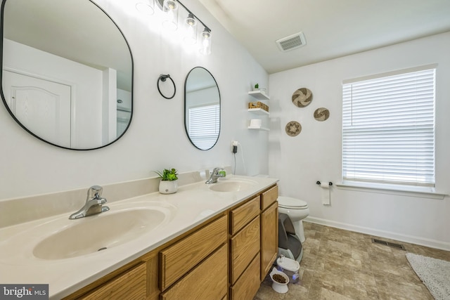 31 Walters Way, Dover, DE 19904 - bathroom featuring toilet, double vanity, and baseboards