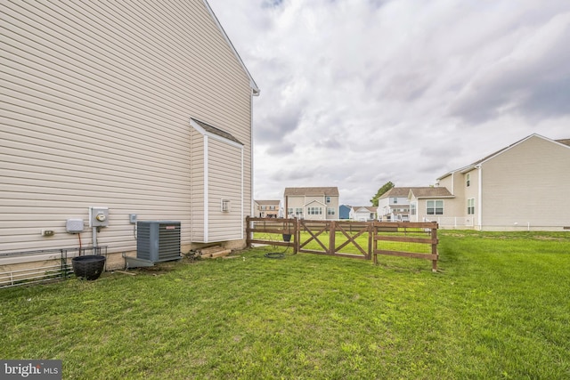 31 Walters Way, Dover, DE 19904 - view of yard with central AC unit and a gate