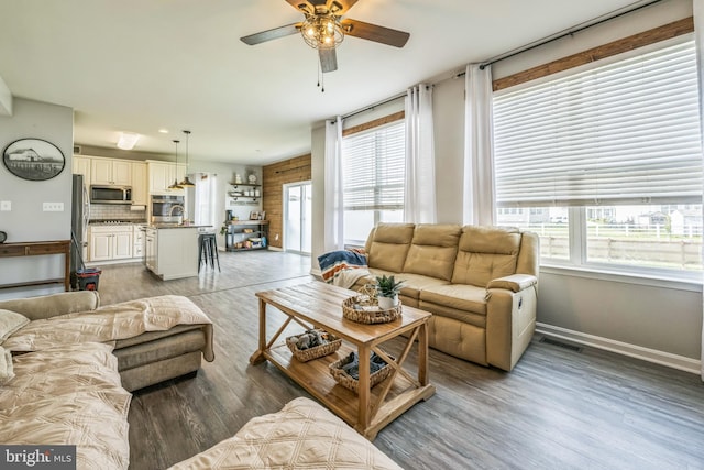 31 Walters Way, Dover, DE 19904 - living area featuring ceiling fan, baseboards, and light wood finished floors