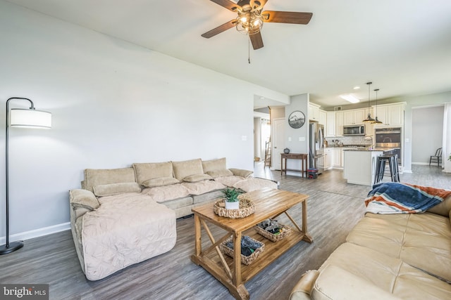 31 Walters Way, Dover, DE 19904 - living room featuring ceiling fan, wood finished floors, and baseboards