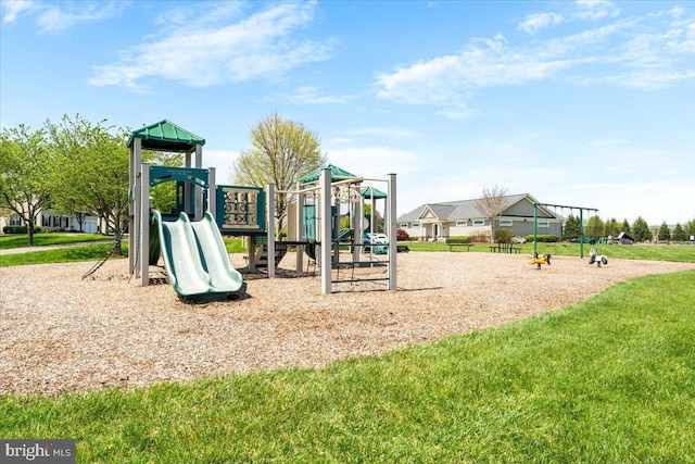 communal playground featuring a lawn