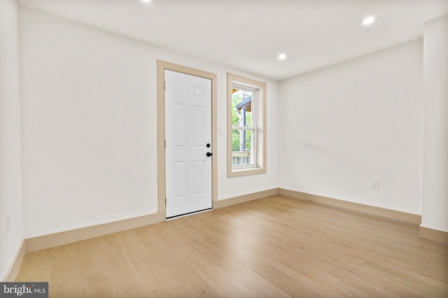 foyer featuring recessed lighting, baseboards, and wood finished floors