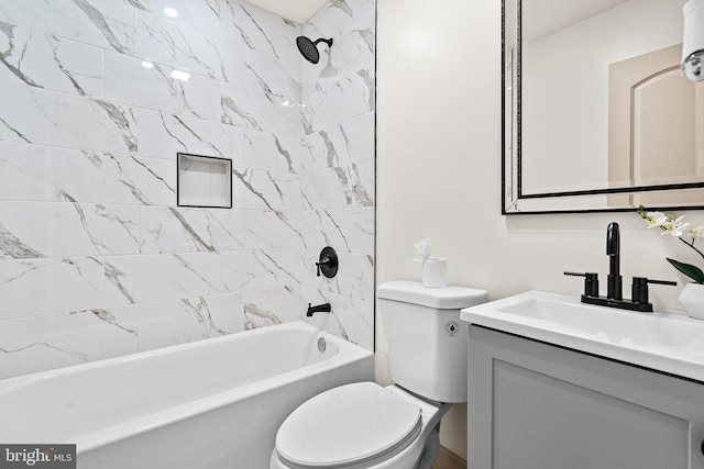 bathroom featuring vanity, toilet, and tub / shower combination