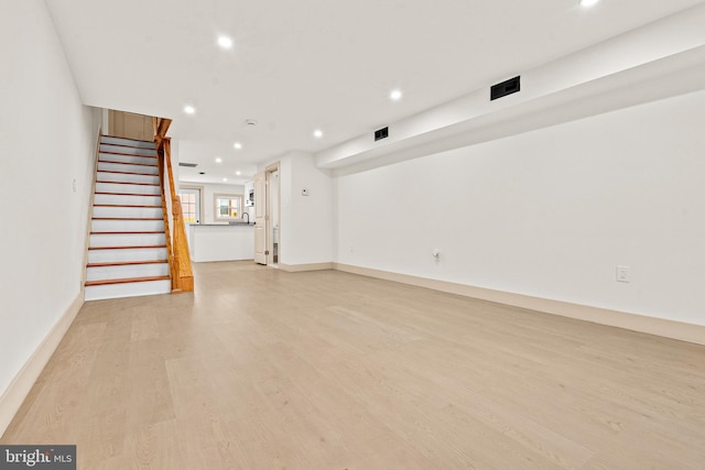 interior space featuring recessed lighting, light wood-style floors, stairs, and visible vents