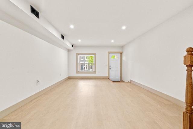 unfurnished room with recessed lighting, visible vents, and light wood-style flooring