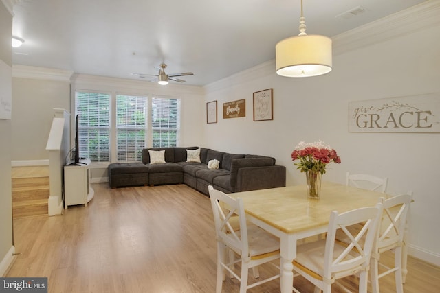 2350 Merseyside Dr, Woodbridge, VA 22191 - dining space with ornamental molding, a ceiling fan, baseboards, and light wood-style floors