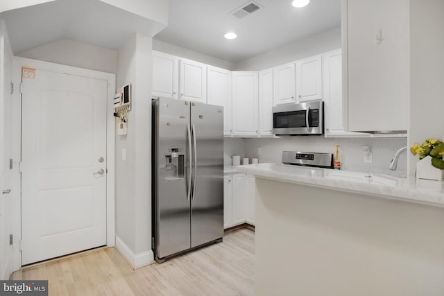 2350 Merseyside Dr, Woodbridge, VA 22191 - kitchen with appliances with stainless steel finishes, light wood-style floors, white cabinetry, light stone countertops, and recessed lighting